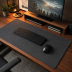 The Felt Desk Mat on a timber desk under a keyboard and mouse